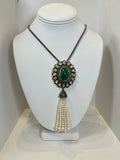 EMERALD AND DIAMOND MEDALLION NECKLACE WITH PEARLS