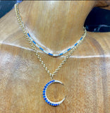 CRESCENT MOON IN BLUE SAPPHIRES AND DIAMONDS