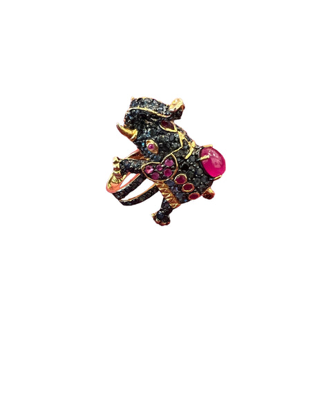 charming ring in the shape of an elephant.  paved in blue sapphires and dark green amethysts, with ruby accents.  the ring is composed of sterling and gold vermeil.  its a size 7