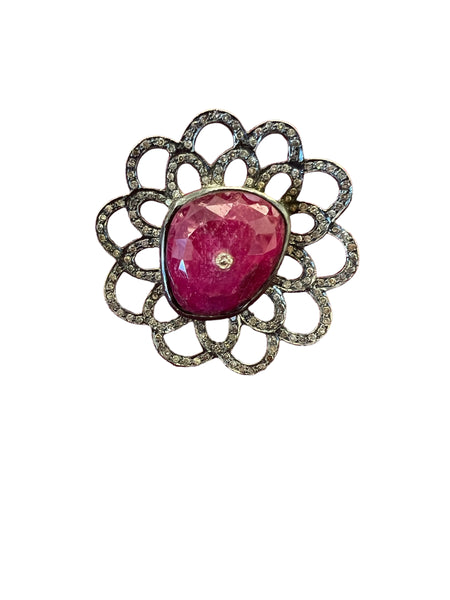 size 7 ring of oxidized sterling with a giant 32 carat ruby center and 2.2 carats of diamonds