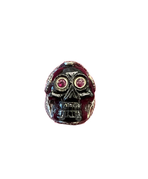 size 6 carved black onyx skull ring with ruby eyes and pave diamond surround.  4.01 carats fo diamonds, 2 carats of rubies.  48,.25 carats of black onyx.  8.488 grams of silver and 1 gram of gold.